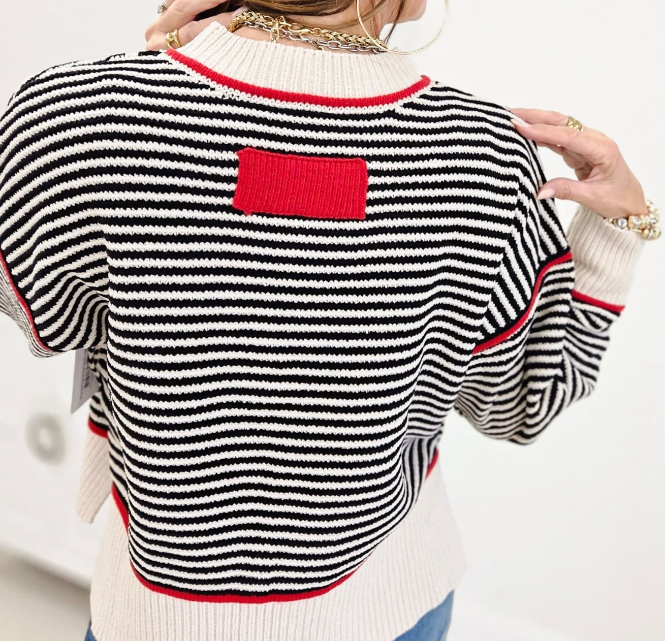 Black Striped Sweater Accented in Red